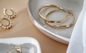 aesthetic golden earrings arrangement