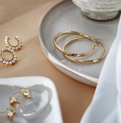 aesthetic golden earrings arrangement
