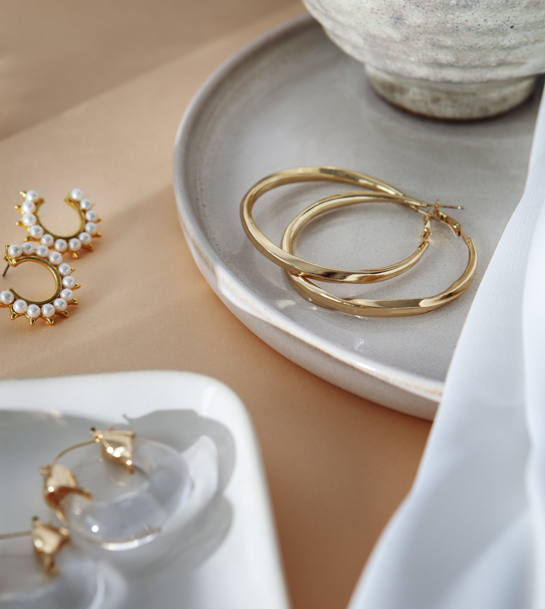 aesthetic golden earrings arrangement